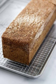 a loaf of bread sitting on top of a cooling rack