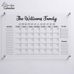 the williams family wall calendar is hanging on a white wall with clipboards attached to it