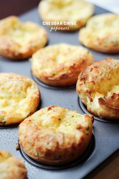 there are many muffins on the tray ready to be baked