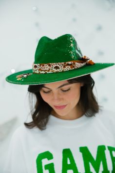 This limited edition FIRST DOWN GREEN RANCHER hat is crafted with green rancher fabric, a stylish bandana band, gold glitter, and a unique football patch. The perfect combination of bold and sophisticated touches make this one-of-a-kind hat truly stand out. This hat is ONE OF A KIND, created by our owner Stephanie. To receive item quicker, expedited shipping is available at checkout. Green Hat Bands For Kentucky Derby, Green Adjustable Hat Bands For Kentucky Derby, Green Western Hat Bands For Kentucky Derby, Western Green Hat Bands For Kentucky Derby, Adjustable Green Hat Bands For Kentucky Derby, Adjustable Green Hat Band For Kentucky Derby, Western Green Hat Band For Festivals, Western Green Hat Bands For Festival, Green Western Style Hat Band For Festivals