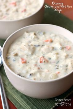 two white bowls filled with soup on top of a green place mat