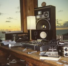 there are many electronic devices on the table together in this room with an ocean view