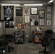 a room filled with lots of art on the wall