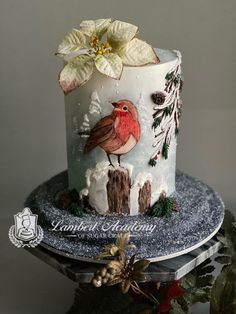 a decorated christmas cake sitting on top of a table