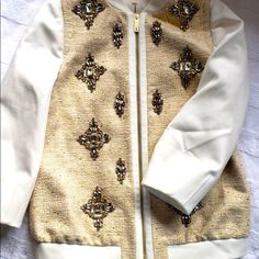 This Is Such A Lovely Jacket By Ted Baker. This Bomber Styled Jacket Is Decorated Embellished With Crystal Stones To Make This Jacket Elegantly Sparkle . This Eye Catching Jacket Has Hints Of Gold And Natural Burlap Color Complemented By Ivory Tones. Gently Used Once , Perfect To Make Any Outfit Stand Out. Open To Offers Ted Baker Jacket, Embellished Jacket, Color Complement, Flower Embroidery Designs, Crystal Stones, Flower Embroidery, Cream And Gold, Embroidery Flowers, Stones And Crystals