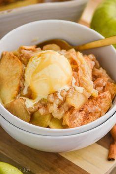 a bowl filled with apple crisp and ice cream