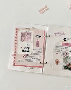 an open scrapbook with some stickers on it