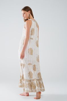 Length: Maxi length. Subcategory: Dress. Sleeves: Sleeveless style. Print: Floral print. Fit: Relaxed fit. Style: Boho. Fabric: Chiffon. runs true to size. S. 100% Viscose Lining: 100% Polyester Elegant Sleeveless Printed Maxi Dress, Sleeveless Gold Maxi Dress For Beach, White Floral Print Maxi Sleeveless Dress, Sleeveless Gold Beach Dresses, Gold Sleeveless Beach Dress, Chic Long Gold Maxi Dress, Chic Gold Maxi Dress For Beach, Gold Maxi Dress For Summer Beach, Sleeveless Gold Dress For The Beach