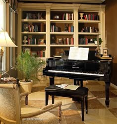 a living room filled with lots of furniture and a grand piano in front of a bookshelf