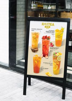 a sign showing the different types of drinks on display in front of a store window