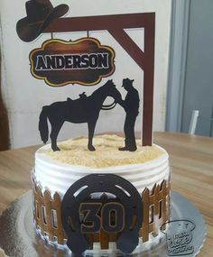 a birthday cake with a cowboy on top and the number 30 in front of it