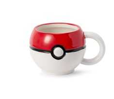 a white and red coffee cup with a black pokeball on the inside, sitting in front of a white background