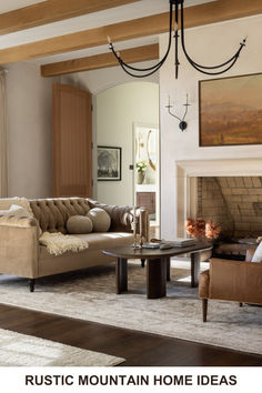 a living room filled with furniture and a fire place under a chandelier in front of a fireplace