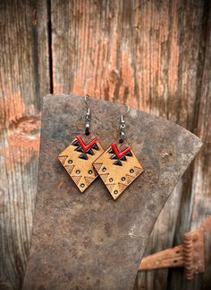 Hand tooled, hand stamped, and hand painted. Made with genuine Hermann Oak veg tan leather. Our earrings are feminine yet rustic, inspired by the raw untamed beauty of Montana.  Stainless steel hooks. Very light weight. One sided design. Approximate size: 1 3/8" x 1 1/2" Thank you for supporting my small business!  Please message me with any questions or requests! - Jordan @IronHorseTradingCo Handmade Southwestern Leather Earrings, Southwestern Brown Concho Earrings, Southwestern Style Brown Concho Earrings, Southwestern Hand Tooled Earrings As Gift, Southwestern Hand Tooled Earrings For Gift, Southwestern Hand-tooled Earrings As Gift, Hand Tooled Southwestern Earrings For Gift, Hand-tooled Brown Earrings For Festival, Rustic Hand Tooled Leather Earrings