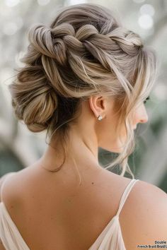 A classic and elegant updo featuring two French braids woven from the front towards the back and secured in a bun. (DIY Tip: Start two French braids at the temples, braiding down towards the back of the head, then secure them together in a bun.) Braided Headband Updo, Mother Of The Bride Hairstyles, Loose Side Braids, Dutch Braid Updo, Mother Of The Groom Hairstyles, Wedding Hairs, Updo With Headband, Two French Braids, Messy Bun With Braid