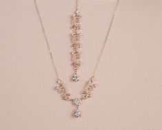 "I've created this dainty bridal necklace with the highest quality European crystals and pearls.  The filigree crystal encrusted components create a delicate and romantic look  I use only high quality chains/materials. All my jewelry is nickel free. Front focal measures 3\" long.  The drop measures 1.25\" Backdrop length in photos: 6\" Choose from 6\", 7\" or 8\" Matching Earrings: https://www.etsy.com/listing/266293544/pearl-drop-bridal-earrings-rose-gold https://www.etsy.com/listing/1109210811 Dainty Gold Rhinestone Necklace For Wedding, Dainty Gold Rhinestone Wedding Necklace, Gold Crystal Drop Necklace For Wedding, Bridal Necklace Pearl, Pearl Wedding Necklace, Long Bridal Earrings, Free Front, Crystal Wedding Jewelry, Bridal Pearl Necklace