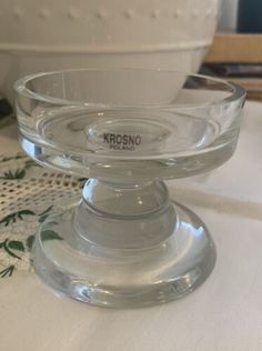 a glass bowl sitting on top of a table