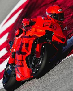 a person riding a motorcycle on a race track