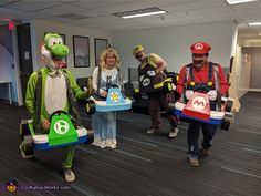 some people are dressed up as mario and luigi in costumes for an office halloween party