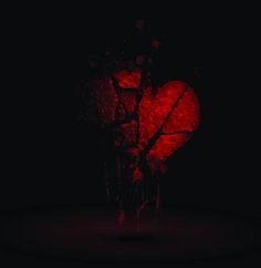 a heart shaped object in the dark with blood dripping from it's sides and on its side