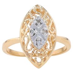 Size: 6 1/4 Sizing Fee: Up 2 sizes for $35 or Down 3 sizes for $30 Metal Content: 14k Yellow Gold & 14k White Gold Stone Information Natural Diamonds Carat(s): .04ctw Cut: Round Brilliant Color: J - K Clarity: SI2 - I1 Style: Cluster Features: Milgrain-Accented Open Cut Scrollwork Measurements Face Height (north to south): 23/32" (18mm) Rise Above Finger: 9/32" (6.5mm) Weight: 3.0 Grams Stamps: P 14k (worn), DC maker's mark Condition: Pre-Owned Professionally cleaned, polished, and tested to gua