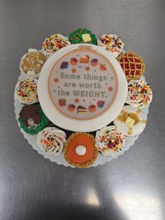 some things are worth the weight cross stitch pattern on a white plate with sprinkles