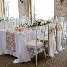 the tables are set with white and gold linens