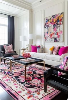 a living room filled with furniture and colorful pillows