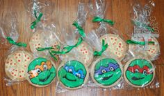 decorated cookies in plastic wrappers on a table