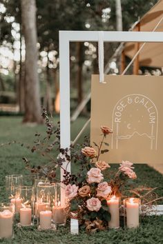 an outdoor ceremony with candles and flowers