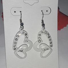 Nwt Brand Fashion Earrings Color White Double Heart Earrings White Metal Earrings For Valentine's Day, Valentine's Day White Metal Earrings, White Dangle Heart Earrings With Ear Wire, White Pierced Heart Earrings For Valentine's Day, White Pierced Earrings For Valentine's Day, Elegant White Metal Heart Earrings, White Valentine's Day Earrings, White Earrings With Heart Charm As Gift, White Heart Earrings With Ear Wire As A Gift