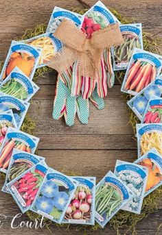 a wreath made out of seed packets and gardening gloves