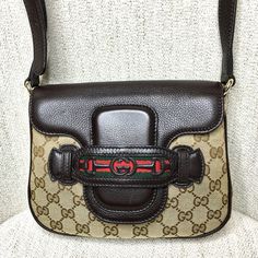 Authentic Gucci Crossbody Bag. Made In Italy. Monogram Canvas With Brown Leather. Signature Red And Green Ribbon Accents. Excellent Condition. Canvas Is Clean. Strap Is Adjustable. Pet And Smoke Free Environment, No Odor. Minimal Signs Of Use On The Linen Lining Inside. Dust Bag Included. 9l X 2d X 6h Classic Instantly Recognizable Gucci Bag. Always In Style! Sku 0566 Gucci Crossbody Bag, Gucci Crossbody, Green Ribbon, Monogram Canvas, Gucci Bag, Brown Leather, Crossbody Bag, Dust Bag, Bag Lady