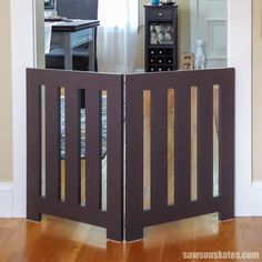 a room divider in the middle of a wooden floor