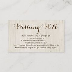 a wooden business card with the words wishing weee written in brown ink on it