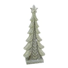 a white ceramic christmas tree with a star on it's top is shown in front of a white background