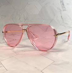 Vintage 70s pink lense  aviators with pink/gold plastic frame. Very stable fit, lightweight. High European quality. New old stock. Never worn. Great condition. UV Protection. NOS Deadstock Made in Europe FIT INFORMATION 60 mm Eye Size 18 mm Bridge 145 mm Temple/Arm Width 5 3/4 Inches Height 2 Inches Pink Aviator Sunglasses For Summer Party, Retro Pink Anti-reflective Sunglasses, Pink Aviator Sunglasses With Gradient Lenses For Beach, Pink Gradient Lenses Aviator Sunglasses, Trendy Pink Aviator Sunglasses For Party, Trendy Pink Aviator Sunglasses With Gradient Lenses, Pink Tinted Aviator Sunglasses For Party, Pink Plastic Shield Sunglasses With Uva Protection, Pink Shield Sunglasses With Uva Protection For Party