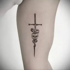 a black and white tattoo with a cross on it