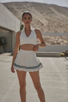 Chic and Comfortable Varsity Tennis Skirt | WISKII Active Chic White Stretch Tennis Skirt, White Sports Skirt For Summer, White Sport Skirt For Summer, White Lined Tennis Skirt For Day Out, Sporty Fitted Tennis Skirt For Day Out, White Preppy Tennis Dress For Spring, White Sports Skirt For Spring, Chic Mini Skort For Tennis, Spring Sports White Skirt