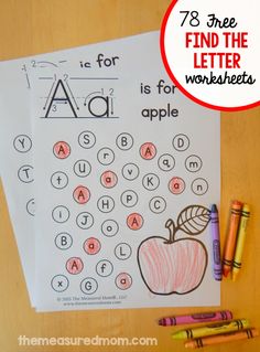 an apple worksheet with crayons and pencils on the table next to it