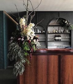 a wooden bar with flowers on it