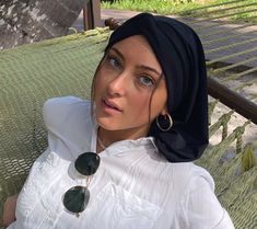 "Relax and unwind in casual headgear Safely covers all your hair Beautiful drape. Top knot headband for height. For long hair or short hair Black modern hijab Classic snood turban for women Personal unique birthday or Valentines Day gift. Uptown Girl Headwear brand ❤️ Fits head size circumference 20-23 inches. Small medium large ❤️ Back is 15\" long, and falls to below your shoulders ❤️ Back is closed, and covers your neck. ❤️ Headband front part is stretchy ❤️ Stretchy lightweight poly blend fa Black Casual Summer Headscarf, Casual Black Summer Headscarf, Casual Adjustable Black Headscarf, Adjustable Black Casual Headscarf, Trendy Black Headwrap For The Beach, Trendy Black Headwrap For Beach, Adjustable Black Turban For Beach, Trendy Black Headscarf In Headband Style, Trendy Black Headscarf In Headband Shape