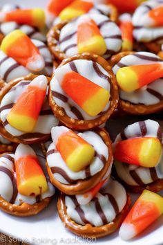 many candy candies are arranged on a white plate and ready to be eaten by the guests