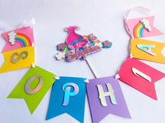 the birthday banner is decorated with colorful paper and cut out letters that spell out numbers