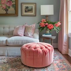 a living room filled with furniture and flowers