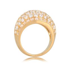 From the Cartier Nigeria collection. This ring is dazzled with collection grade round brilliant cut diamonds with a total approximate weight of 4.10 carats, D-F color, and VVS clarity. This ring is 18k yellow gold, and is signed Cartier, numbered, and has maker marks and French mark’s stamped on the back.
The mm width of the diamond section graduates from 17.50mm – 12.30mm.
The current size of this ring is 7.
If you have any questions about this Cartier Nigeria ring, please feel free to contact us. Luxury Diamond Dome Ring, Luxury Round Dome Diamond Ring, Luxury Dome Ring In Diamond White, Formal Diamond Dome Ring With Brilliant Cut, Luxury Dome Ring With Round Cut Prong Setting, Luxury Dome Ring With Prong Setting, Diamond White Brilliant Cut Dome Ring, Luxury Yellow Gold Dome Ring With Pave Setting, Luxury Yellow Gold Dome Ring With Diamonds