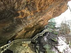 people are walking up and down stairs in the cave