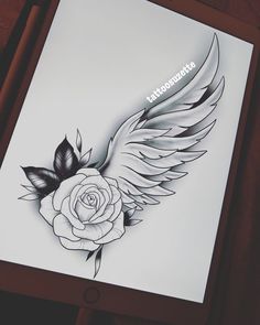 an image of a rose with wings on it