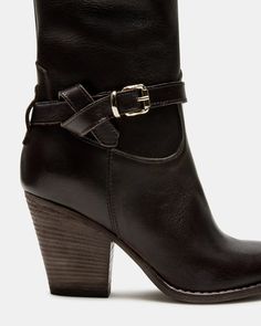 Step into style with the HARDY bootie. Featuring a pointed toe and stacked wood heel, this western-inspired boot also includes a buckle detail and pull tabs. Perfect for any look, these boots are sure to add an edgy touch to your wardrobe. 3 inch heel height 12.25 inch shaft circumference 7.5 inch shaft height Leather upper material Synthetic lining Synthetic sock Synthetic sole Imported Chic Heeled Boots With Buckle For Fall, Fall Ankle Heeled Boots With Buckle Closure, Fall Ankle Boots With Buckle Closure, Chic Moto Boots With Stacked High Heel, Chic Ankle Boots With Buckle Closure, Chic Ankle Heeled Boots With Buckle Closure, Chic Ankle Boot With Buckle Closure, Chic Brown Heeled Boots With Buckle Closure, Chic Moto Boots With Stacked Block Heel