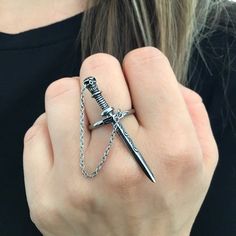 Unique and  artfully crafted Skull Sword ring is made of high grade Stainless Steel and has oxidation for depth and details.Sword is attached by a chain to the ring.-Length of the sword is 1 3/4" -We ship in a gift box. Jellwery Aesthetic, Inexpensive Jewelry, Edgy Jewelry, Biker Jewelry, Magical Jewelry, Punk Jewelry, Dope Jewelry, Funky Jewelry, Cheap Jewelry